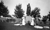 Two Women and One Man with Sakakawea Statue