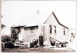 Mrs. Schielke outside house, 1930s