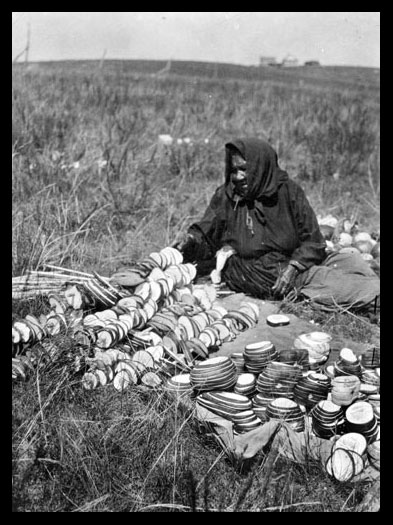 Owl Woman Stringing Squash