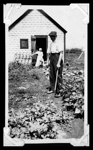 Man Cultivating Garden