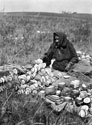 Owl Woman Stringing Squash