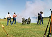 reenactors firing cannon