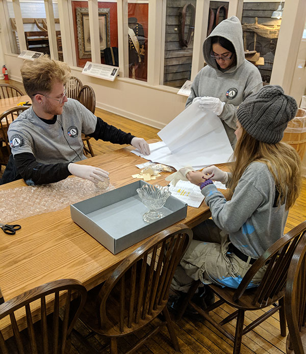 AmeriCorps team members in cataloging